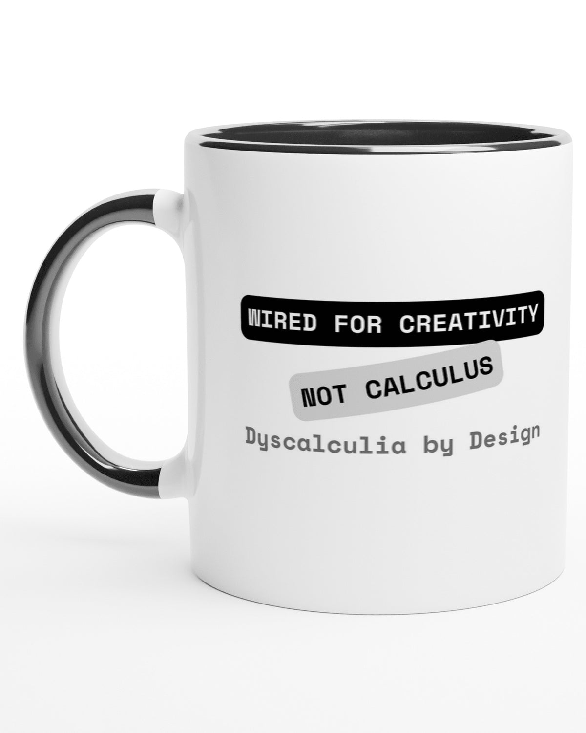 White mug with a black handle reading Wired for Creativity, Not Calculus, Dyscalculia by Design