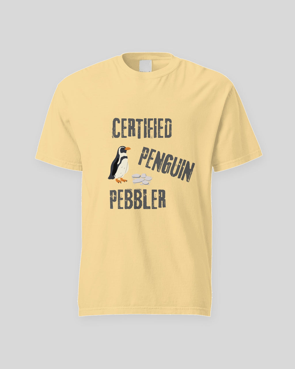Certified Penguin Pebbler tee in Butter, flat front view of the print