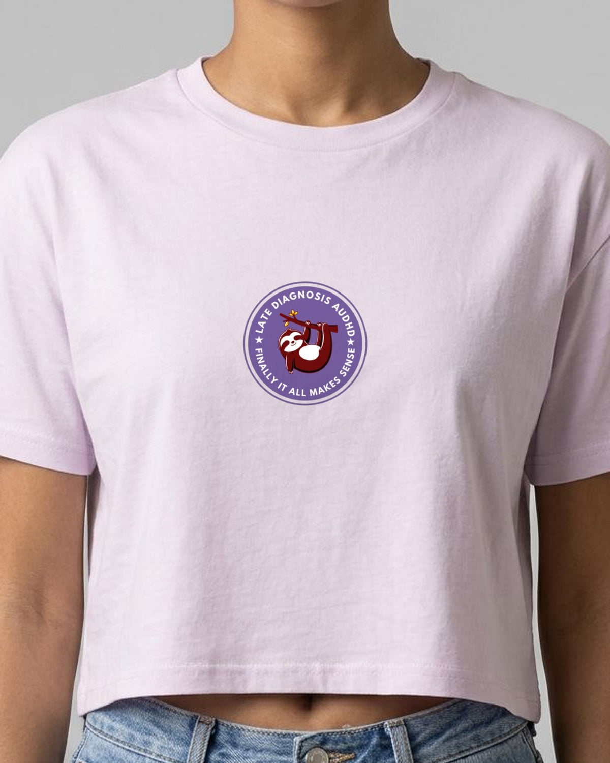 Finally ... AuDHD embroidered crop top in Orchid, worn, close-up of the embroidery