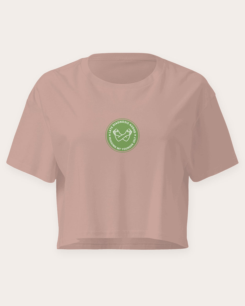 Hugging ... AuDHD embroidered crop top in Hazy Pink, flat front view