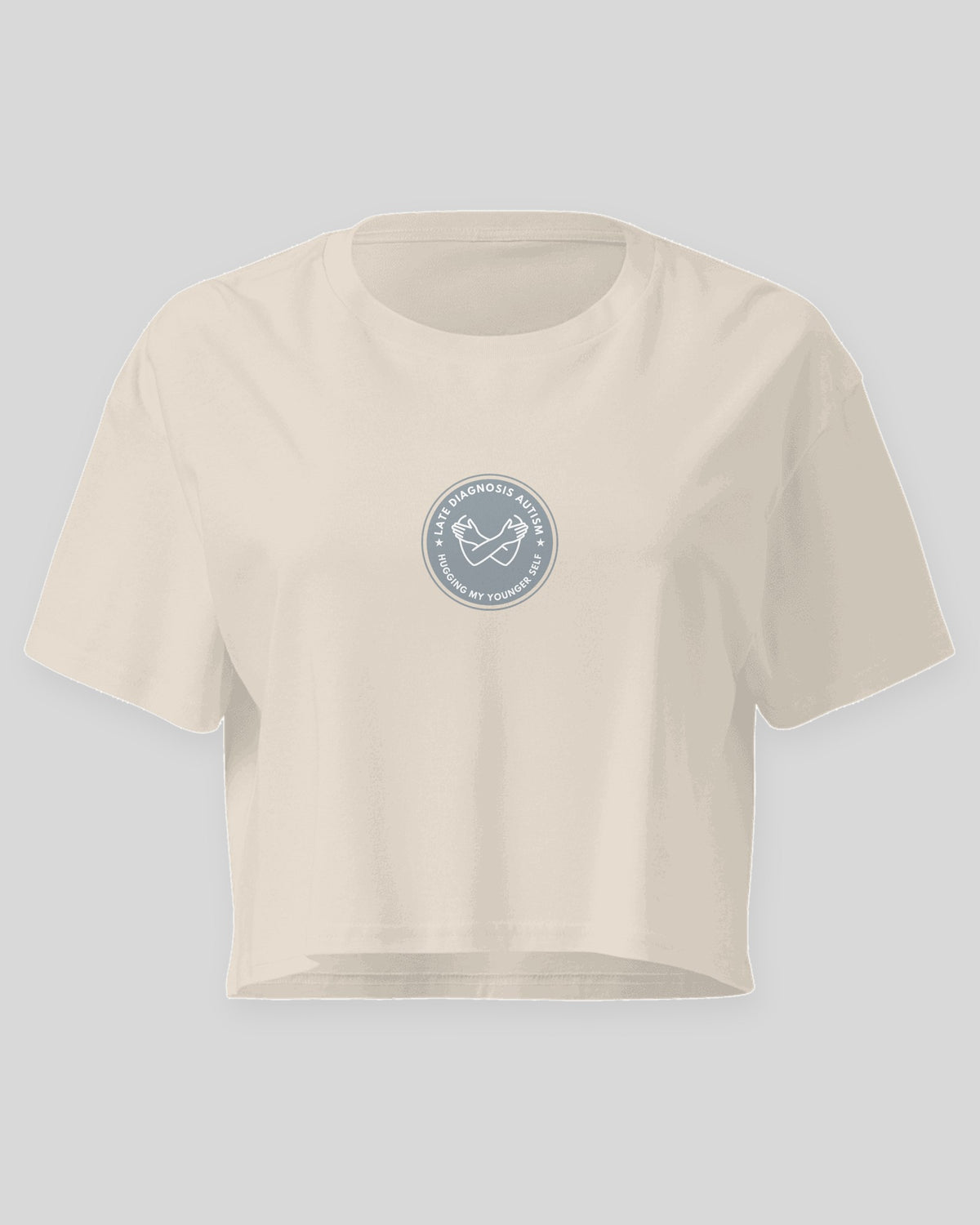 Hugging ... Autism embroidered crop top in Bone, flat front view