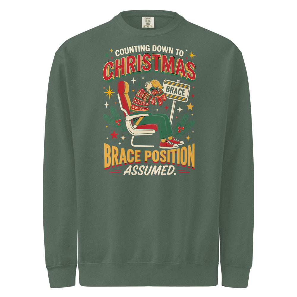 Christmas Countdown: Brace Position sweatshirt in Blue Spruce, front view of the printed design
