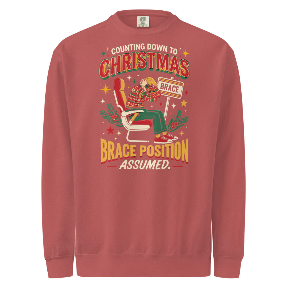 Christmas Countdown: Brace Position sweatshirt in Crimson, front view of the printed design