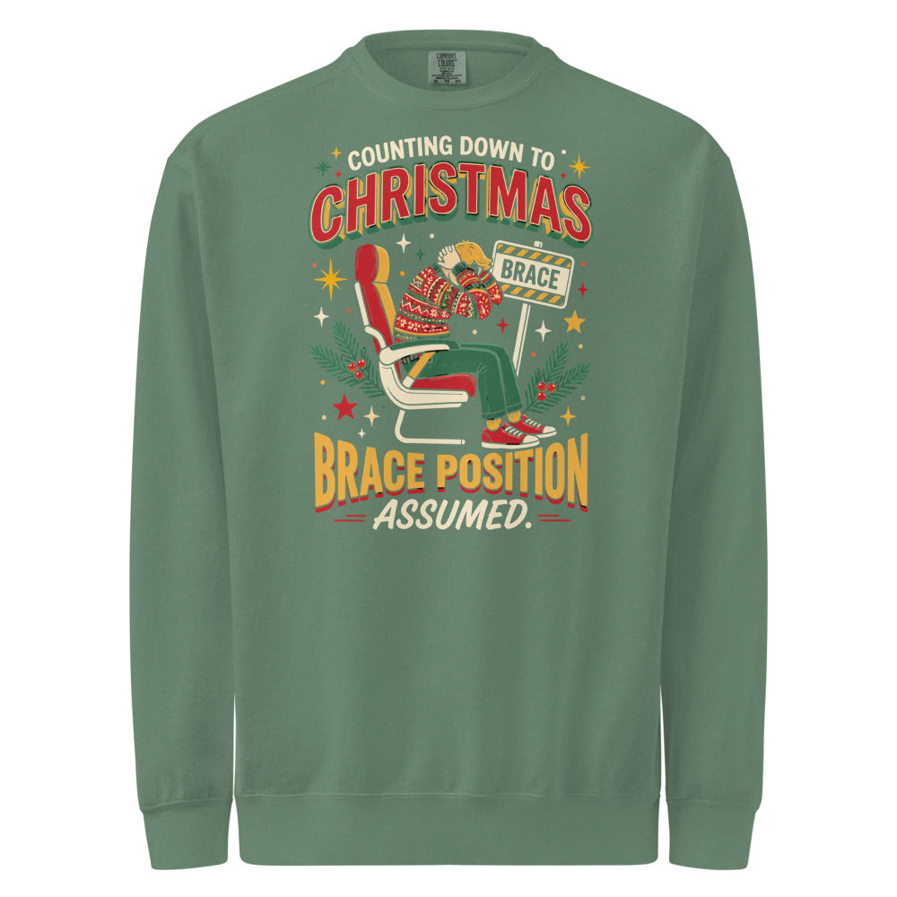 Christmas Countdown: Brace Position sweatshirt in Light Green, front view of the printed design