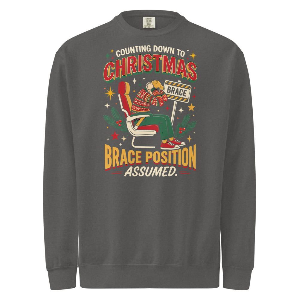 Christmas Countdown: Brace Position sweatshirt in Pepper, front view of the printed design
