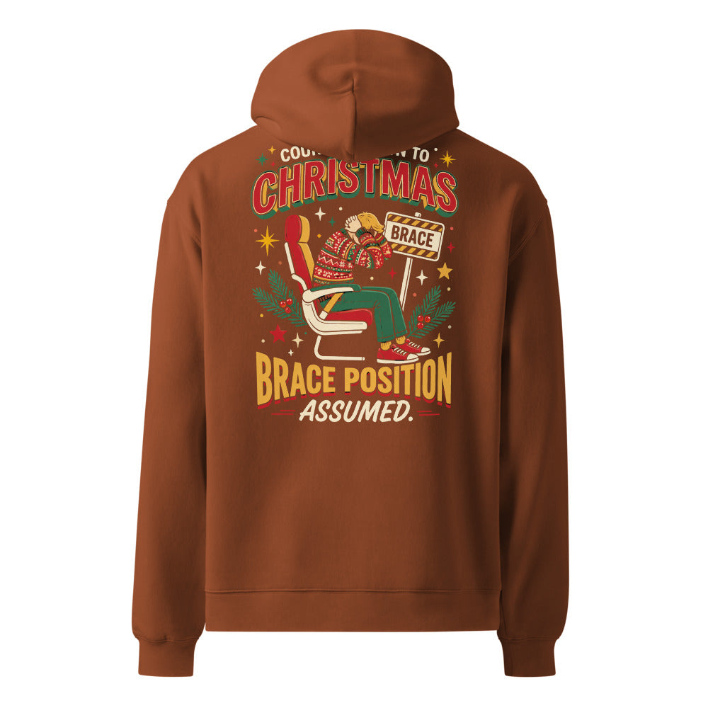 Brace for Christmas! oversized hoodie in Clay, back view of the full-size printed design