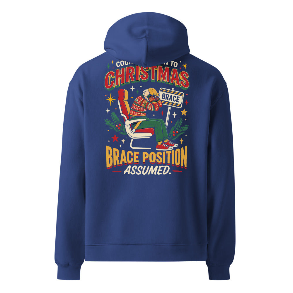 Brace for Christmas! oversized hoodie in Cobalt, back view of the full-size printed design