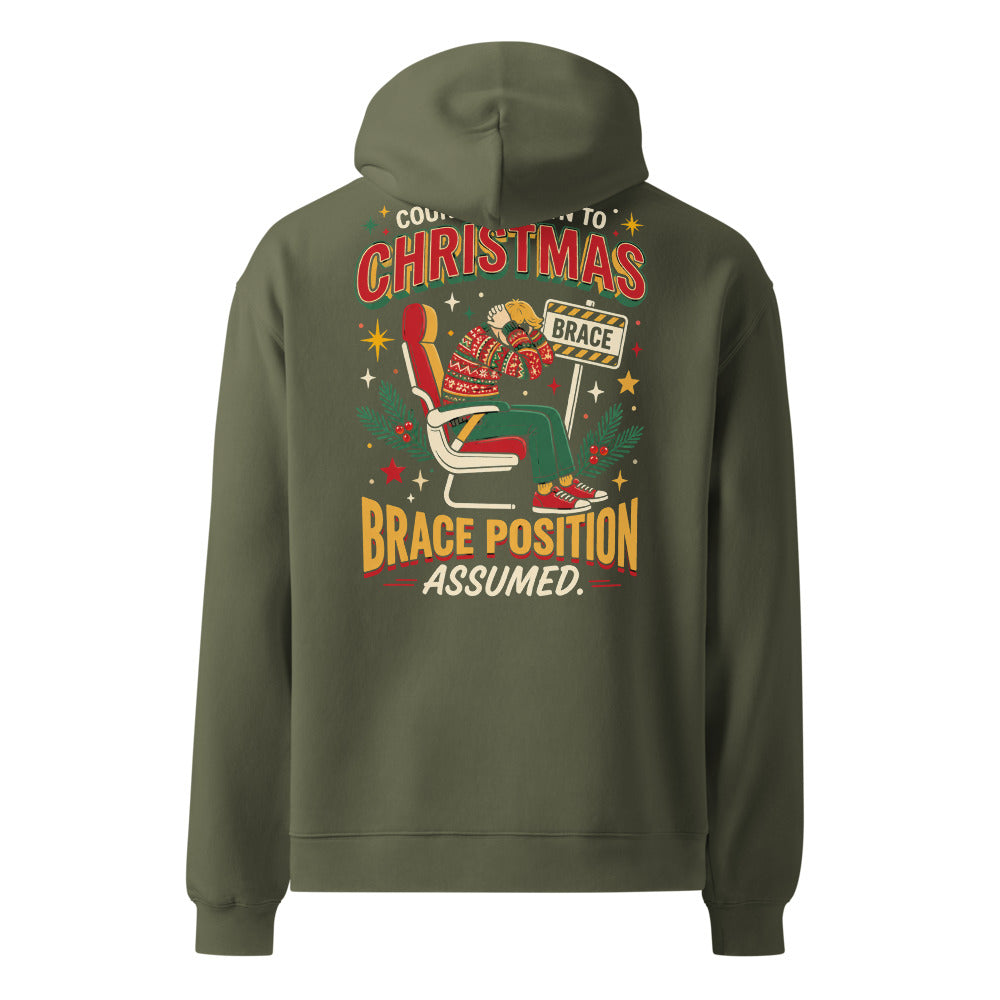Brace for Christmas! oversized hoodie in Cypress, back view of the full-size printed design