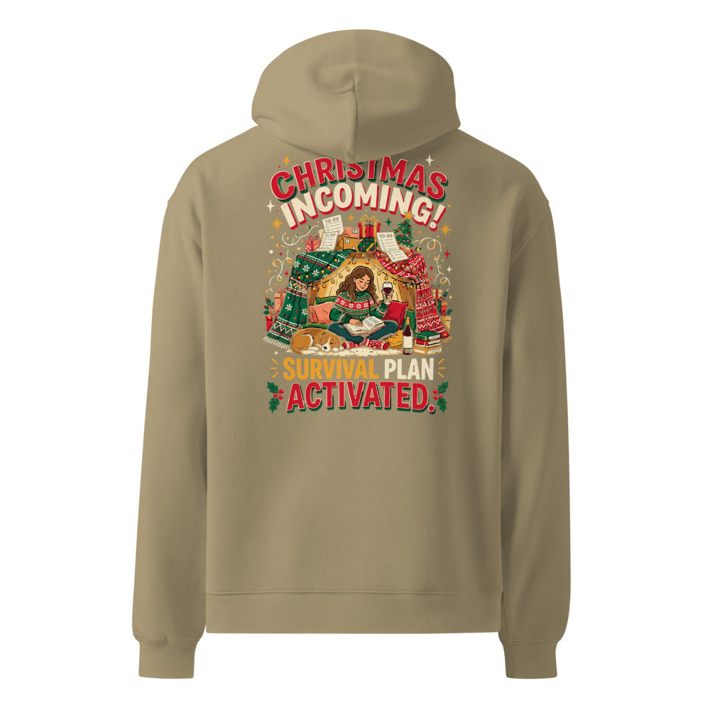 Christmas Incoming! oversized hoodie in Sand, back view of the printed design