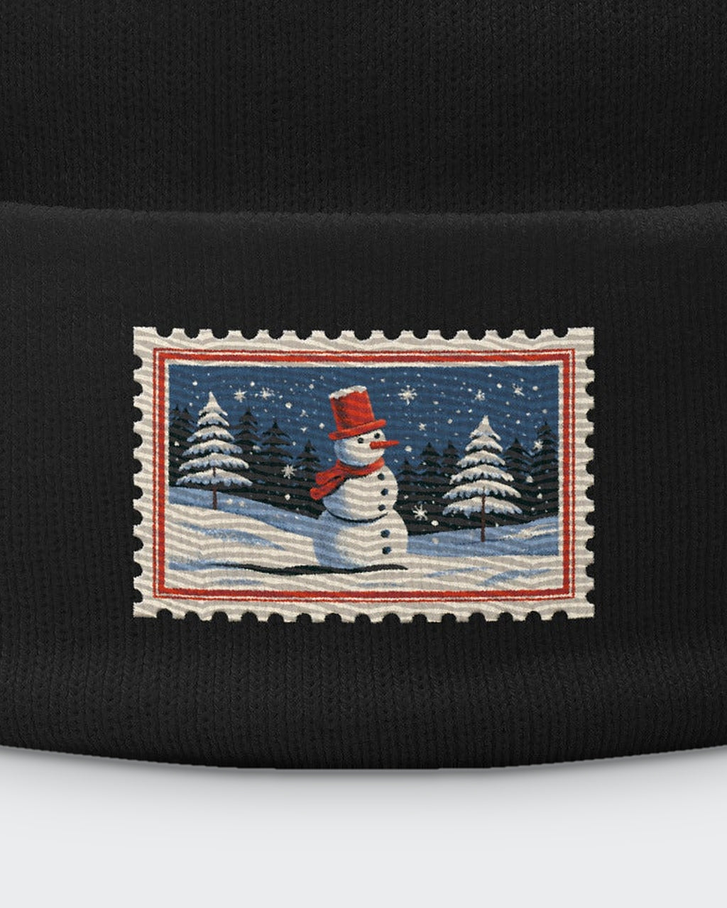 Snowy Stamp embroidered beanie in Black, close-up of the embroidered stamp