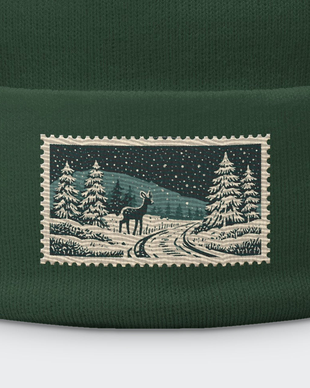 Wintery Cameo embroidered beanie in Dark Green, close-up of the embroidered stamp