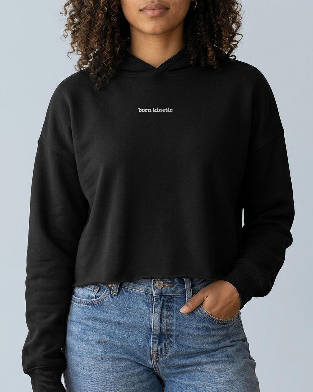 Born Kinetic embroidered crop hoodie in Black, worn, front view
