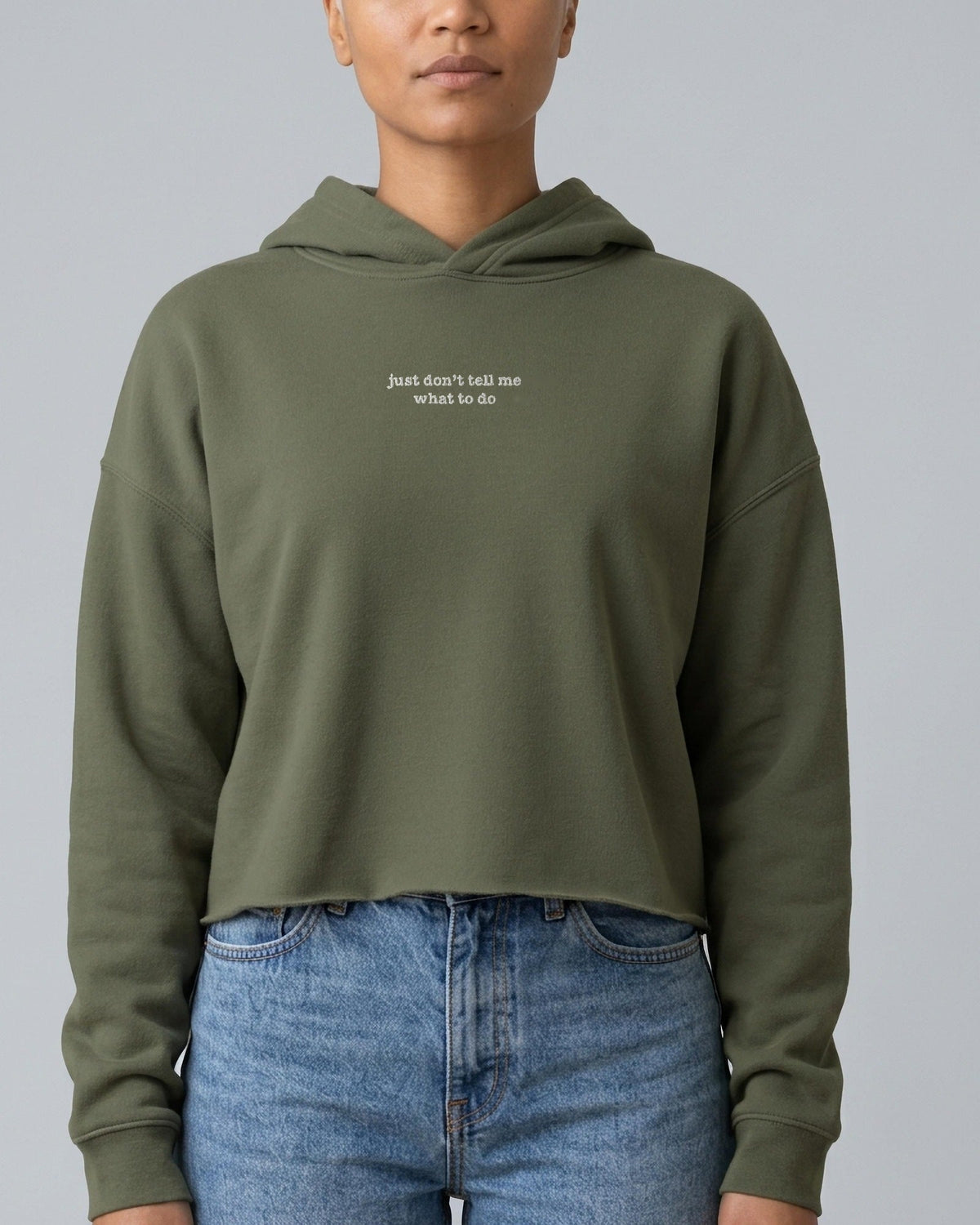 Just Don't Tell Me What to Do embroidered crop hoodie in Military Green, worn, front view