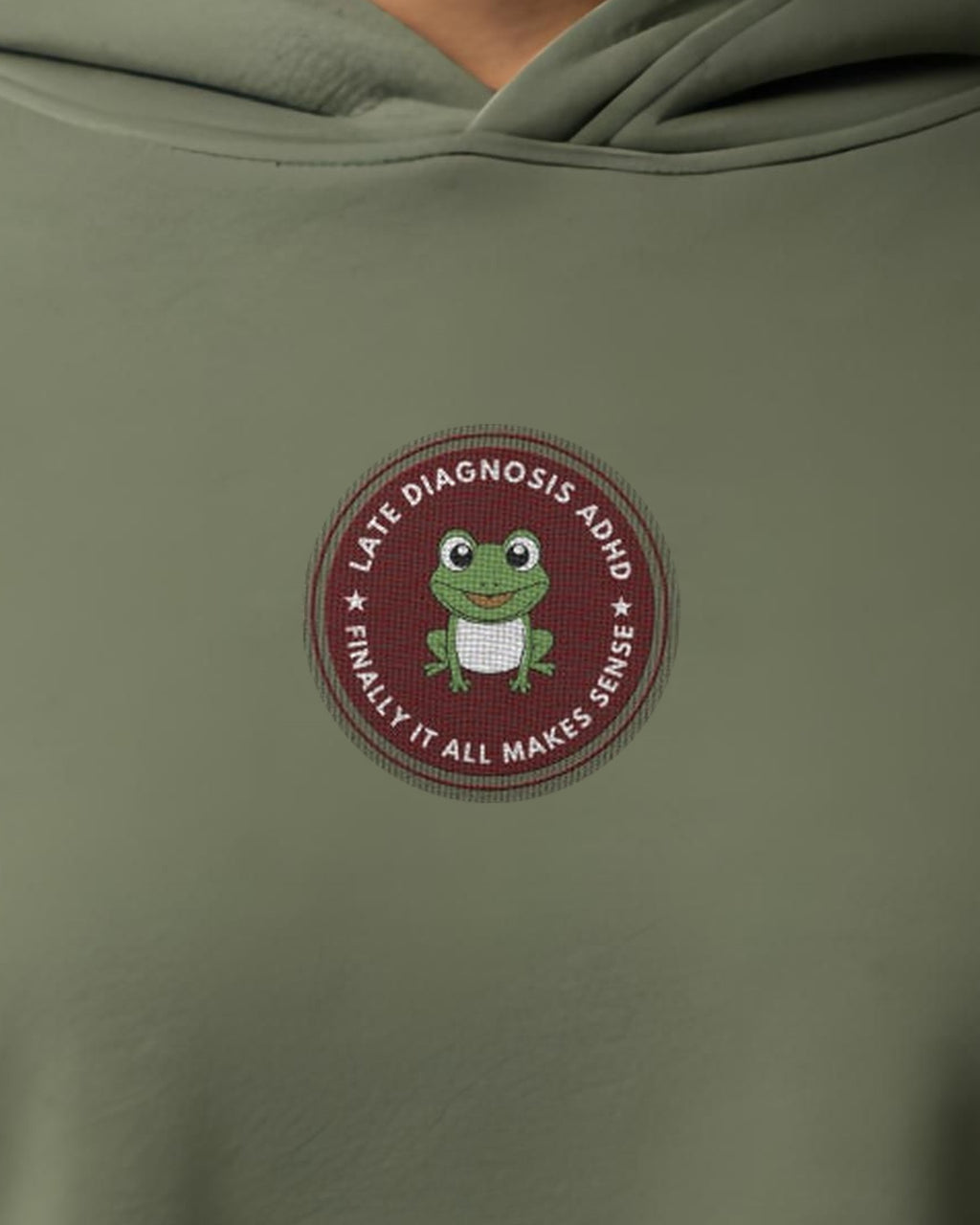 Finally ... ADHD embroidered crop hoodie in Military Green, worn, close-up of the chest design