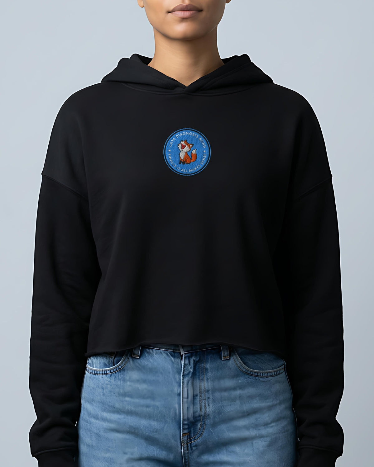 Finally ... AuDHD embroidered crop hoodie in Black, worn, front view