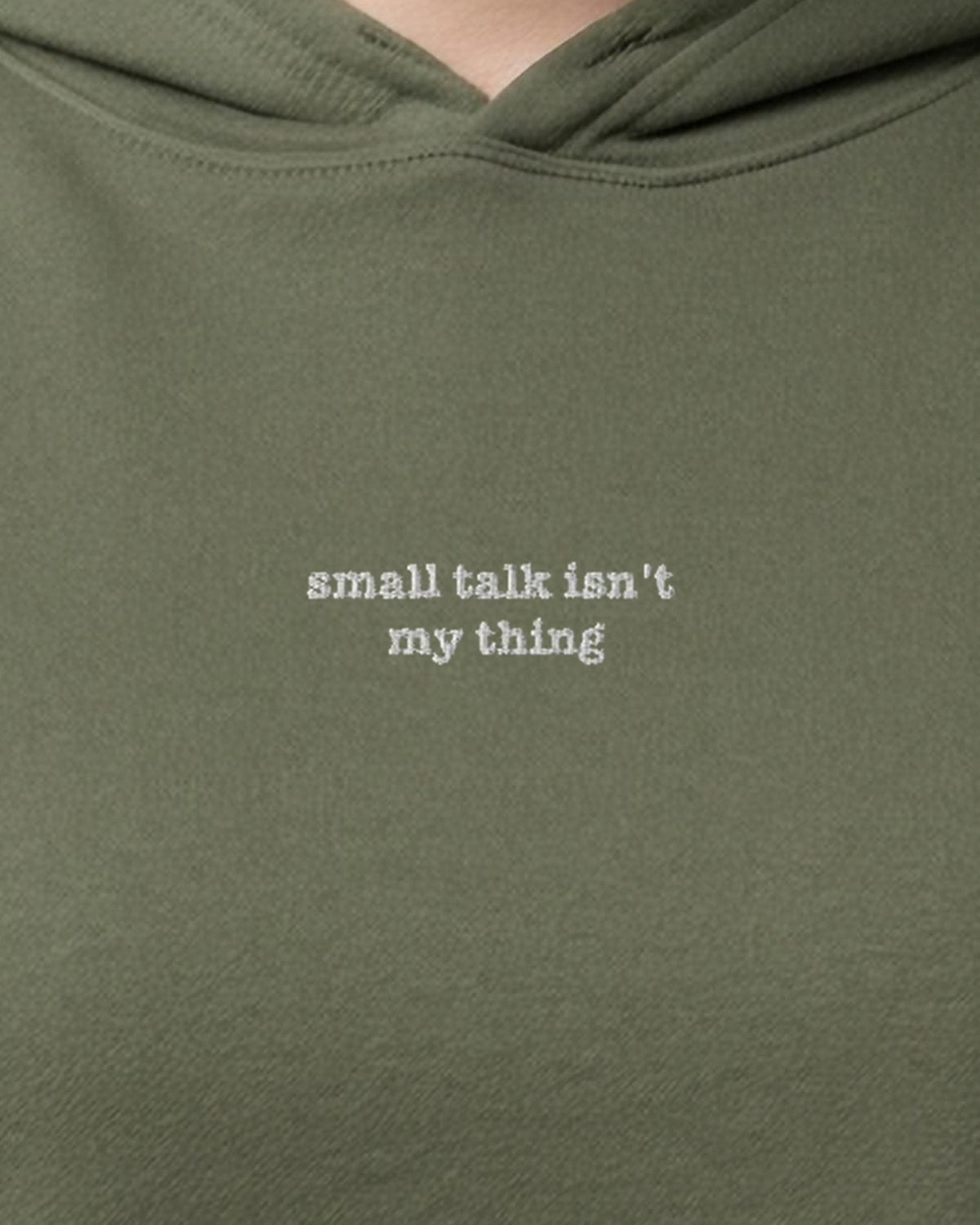 Small Talk Isn't My Thing embroidered crop hoodie in Military Green, worn, close-up of the chest design
