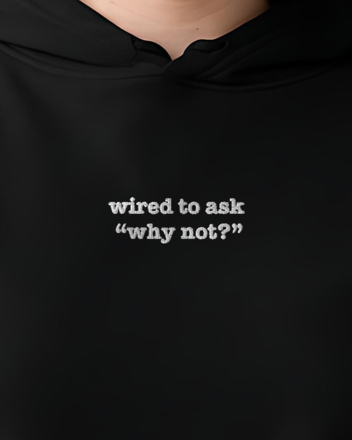 Wired to Ask Why Not? embroidered crop hoodie in Black, worn, close-up of the chest design