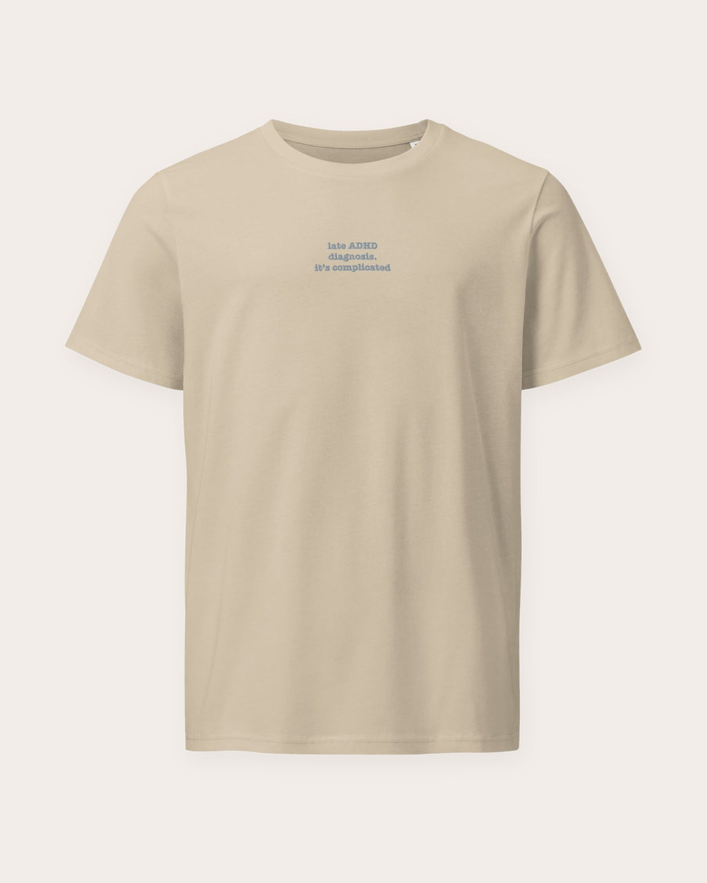 It's Complicated Phrase (ADHD) embroidered organic tee in Desert Dust, laid flat