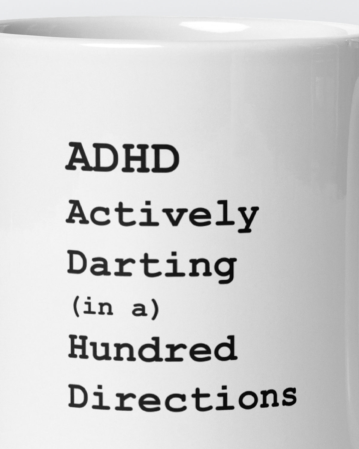 Close-up of the "ADHD: Actively Darting In A Hundred Directions" wording