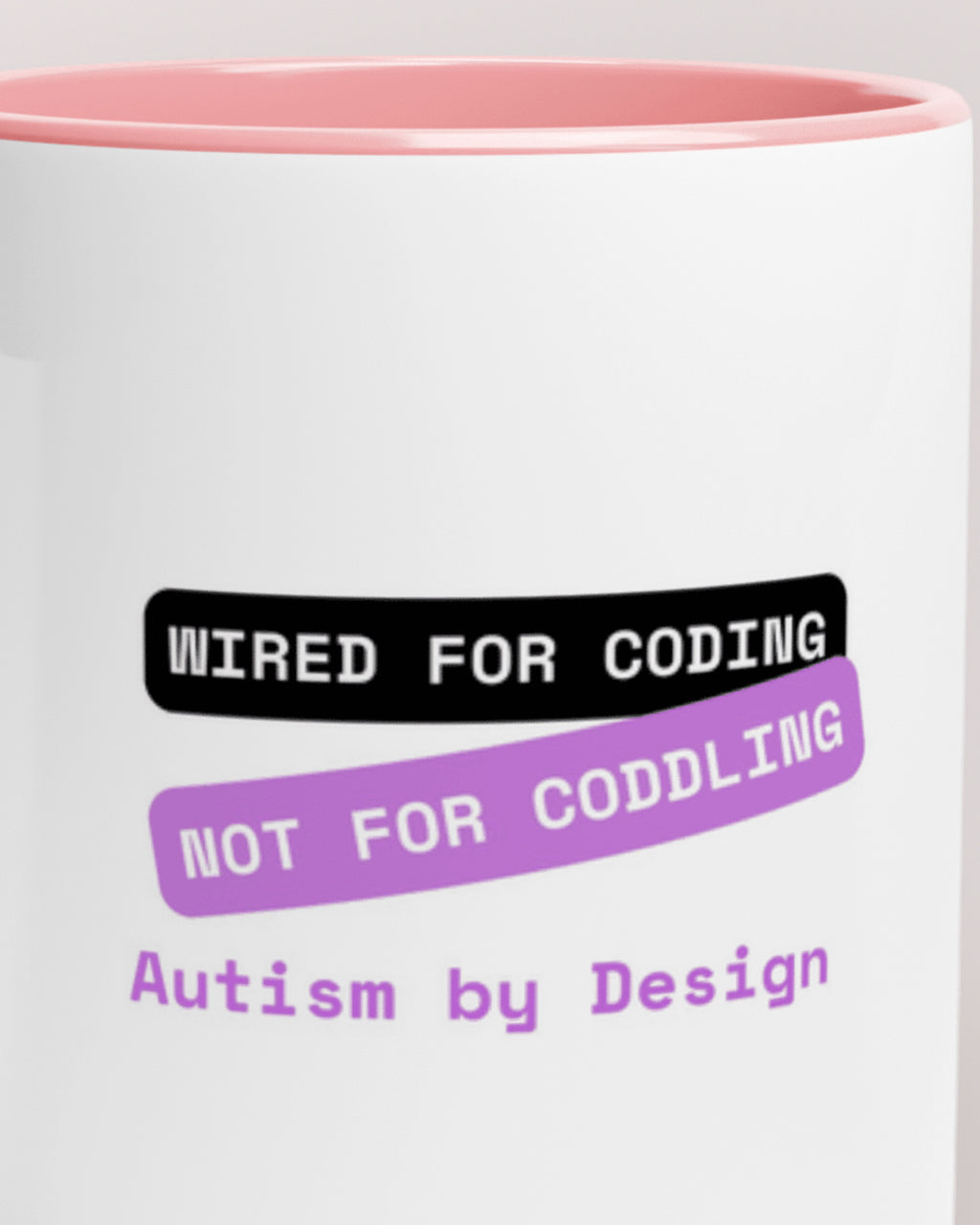 Close-up of the "By Design (Autism) — Wired for Coding" wording