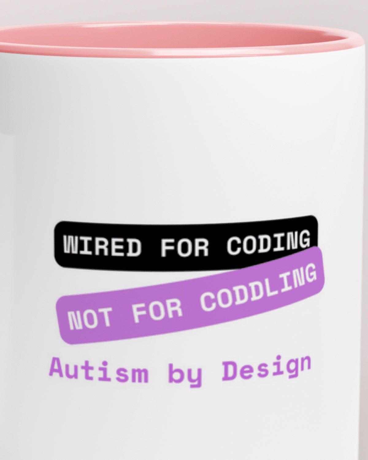 Close-up of the "By Design (Autism) — Wired for Coding" wording