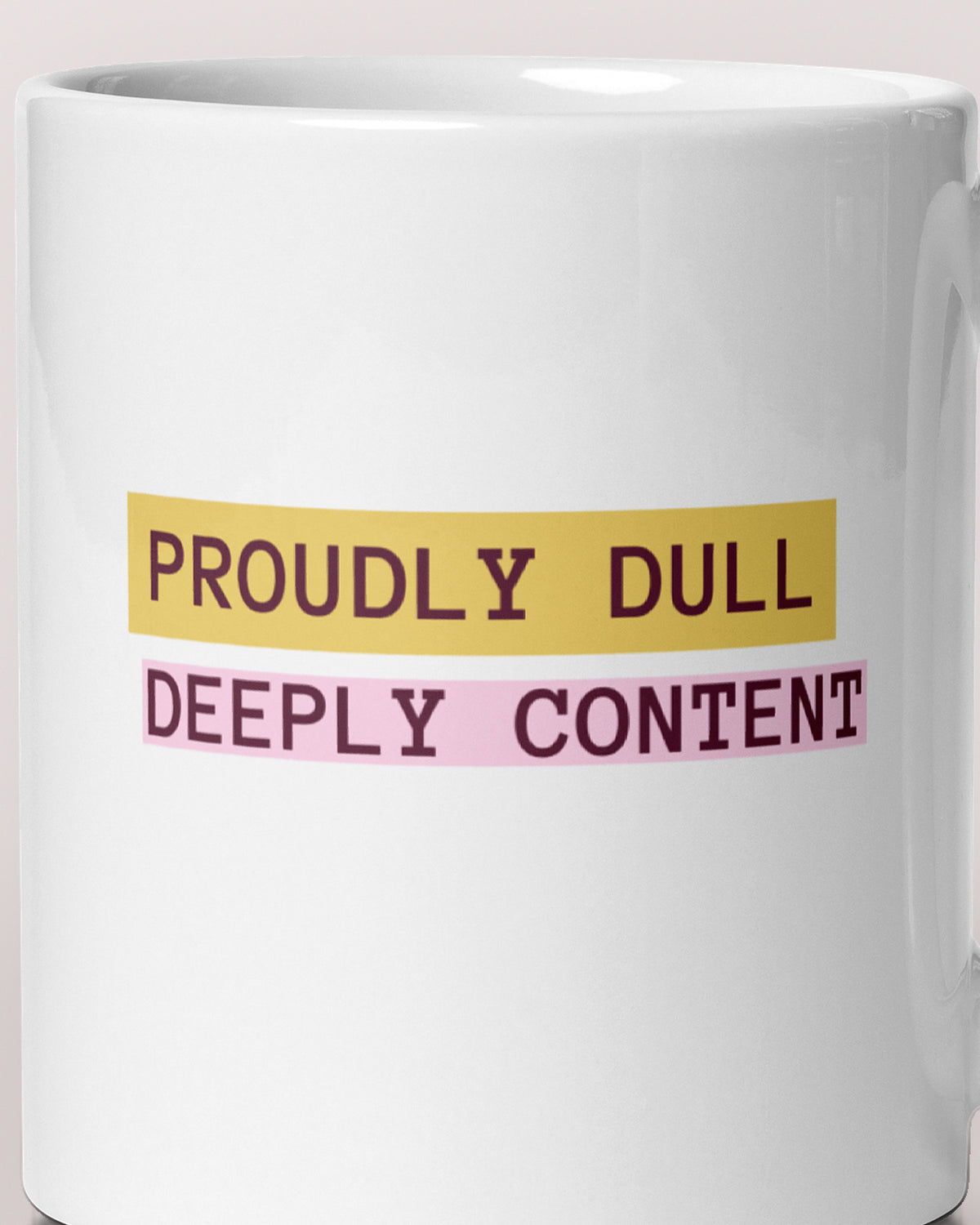 Close-up of the "Proudly Dull, Deeply Content" wording