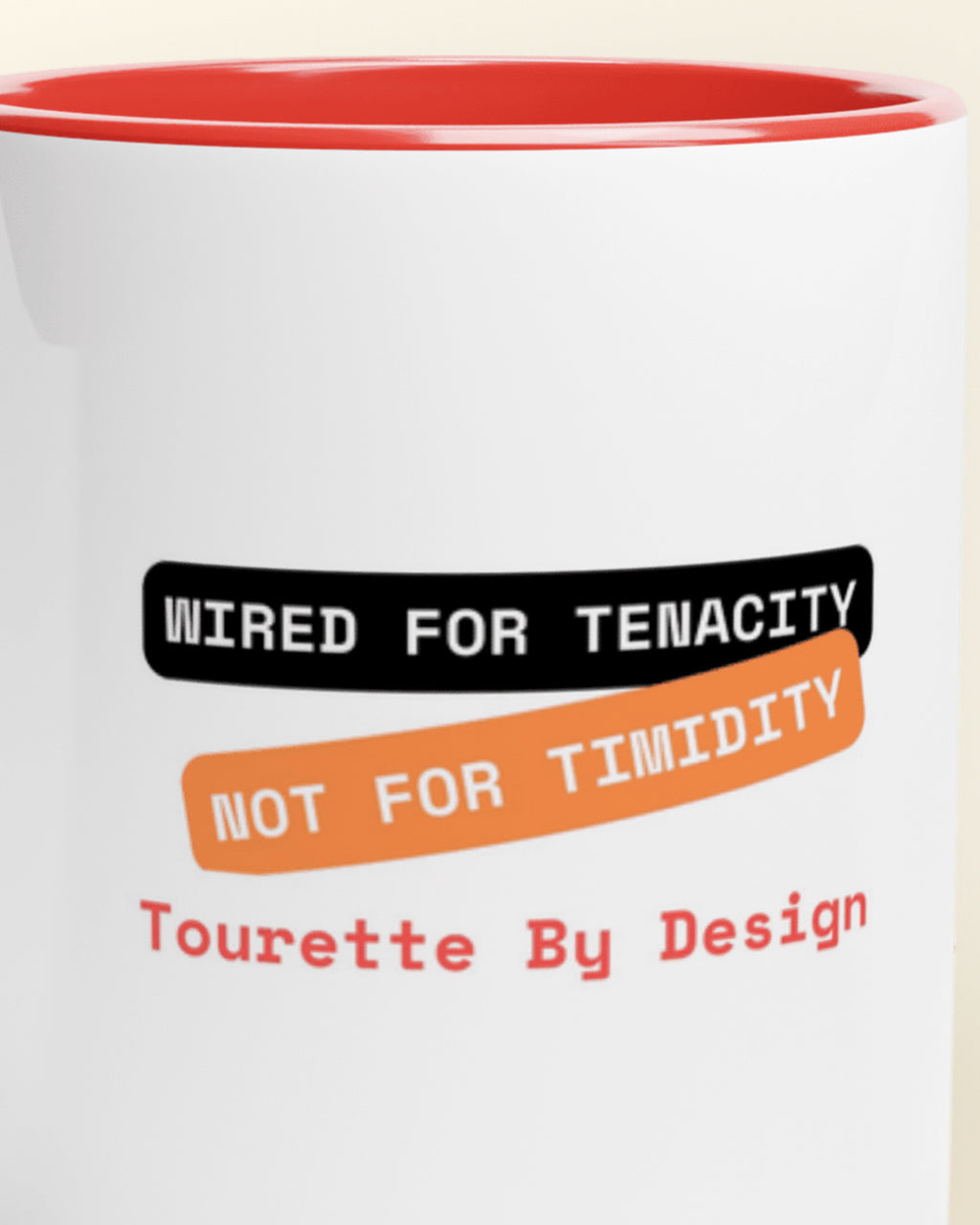Close-up of the "Tenacity not Timidity (Tourette)" wording