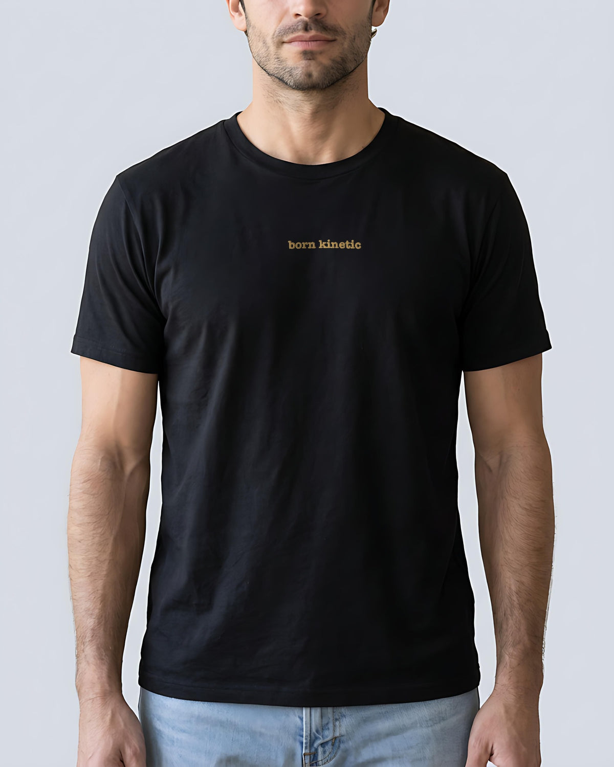 Born Kinetic embroidered organic tee in Black, worn, front view