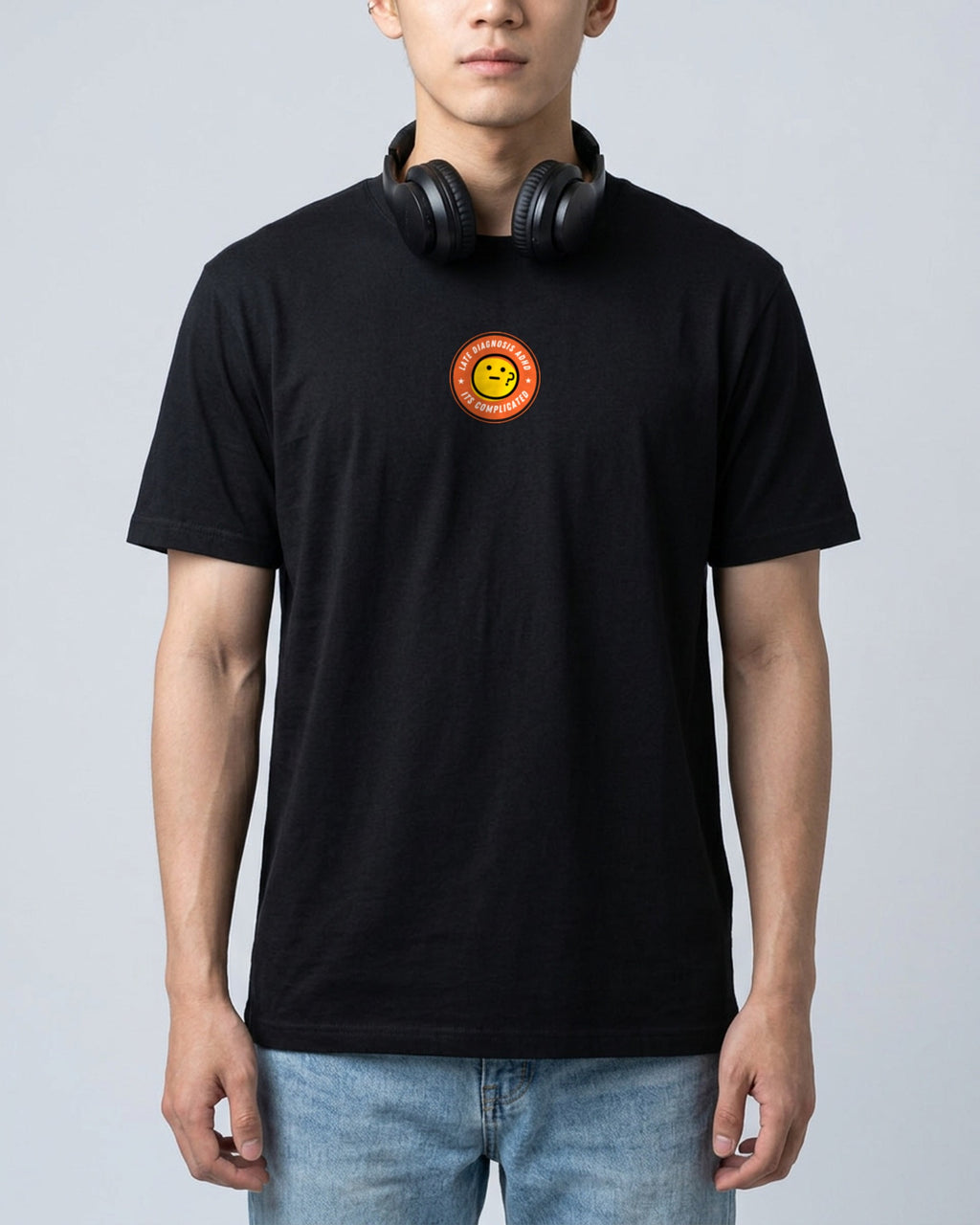 It's Complicated emoji (ADHD) organic embroidered badge tee in Black, worn, full front view