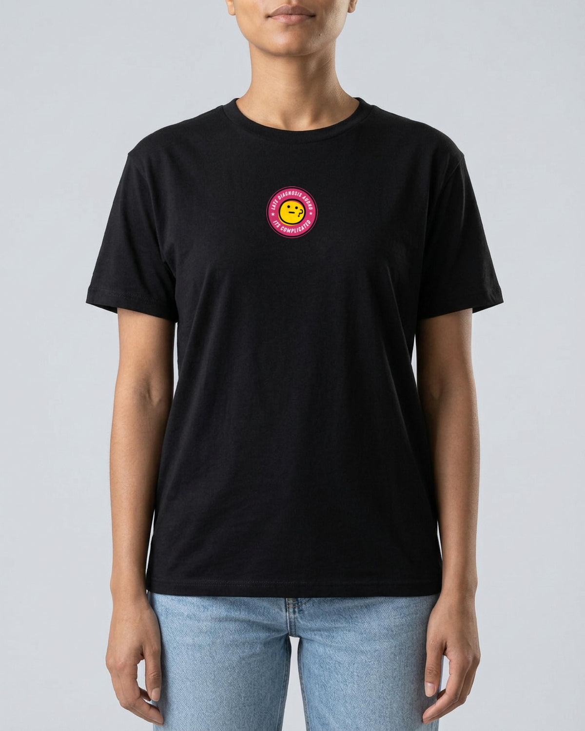 It's Complicated emoji (AuDHD) organic embroidered badge tee in Black, worn, full front view