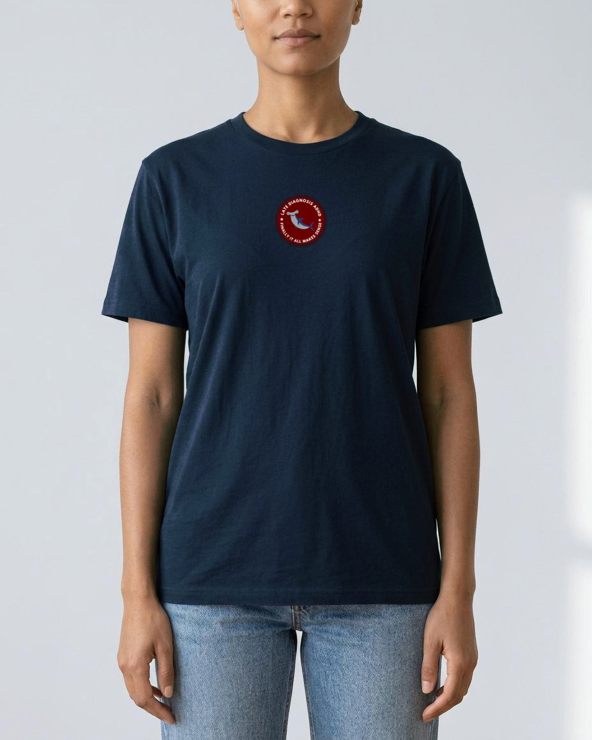 Finally (ADHD) organic embroidered badge tee in French Navy, worn, full front view
