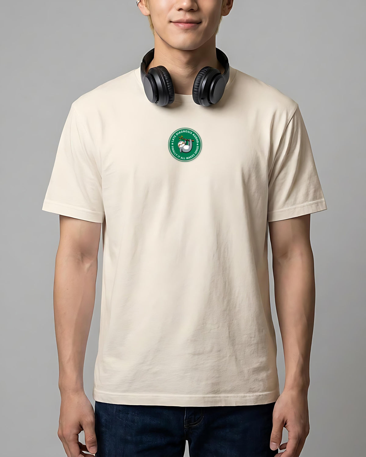 Finally (AuDHD) organic embroidered badge tee in Vintage White, worn, full front view