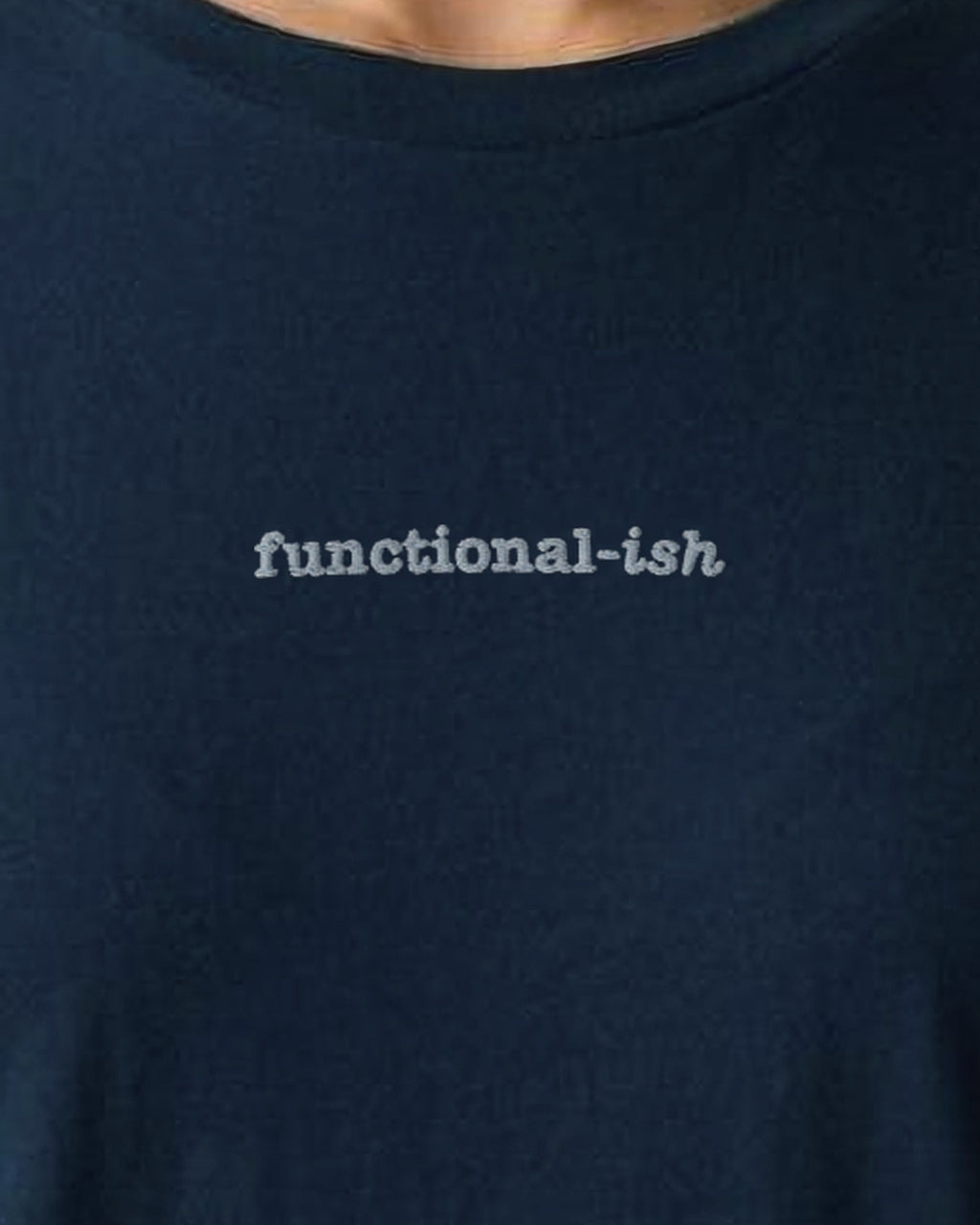 Functional-ish embroidered organic tee in French Navy, worn, close-up of the chest embroidery