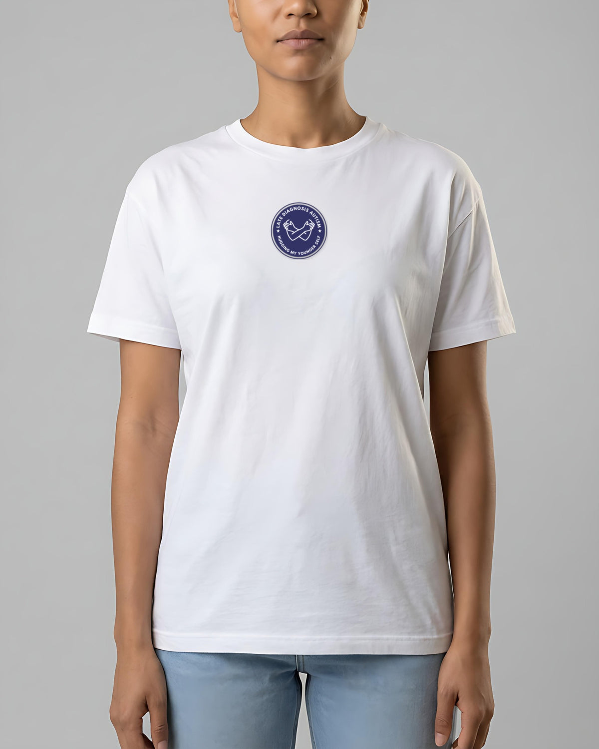 Hugging Autism organic embroidered badge tee in White, worn, full front view