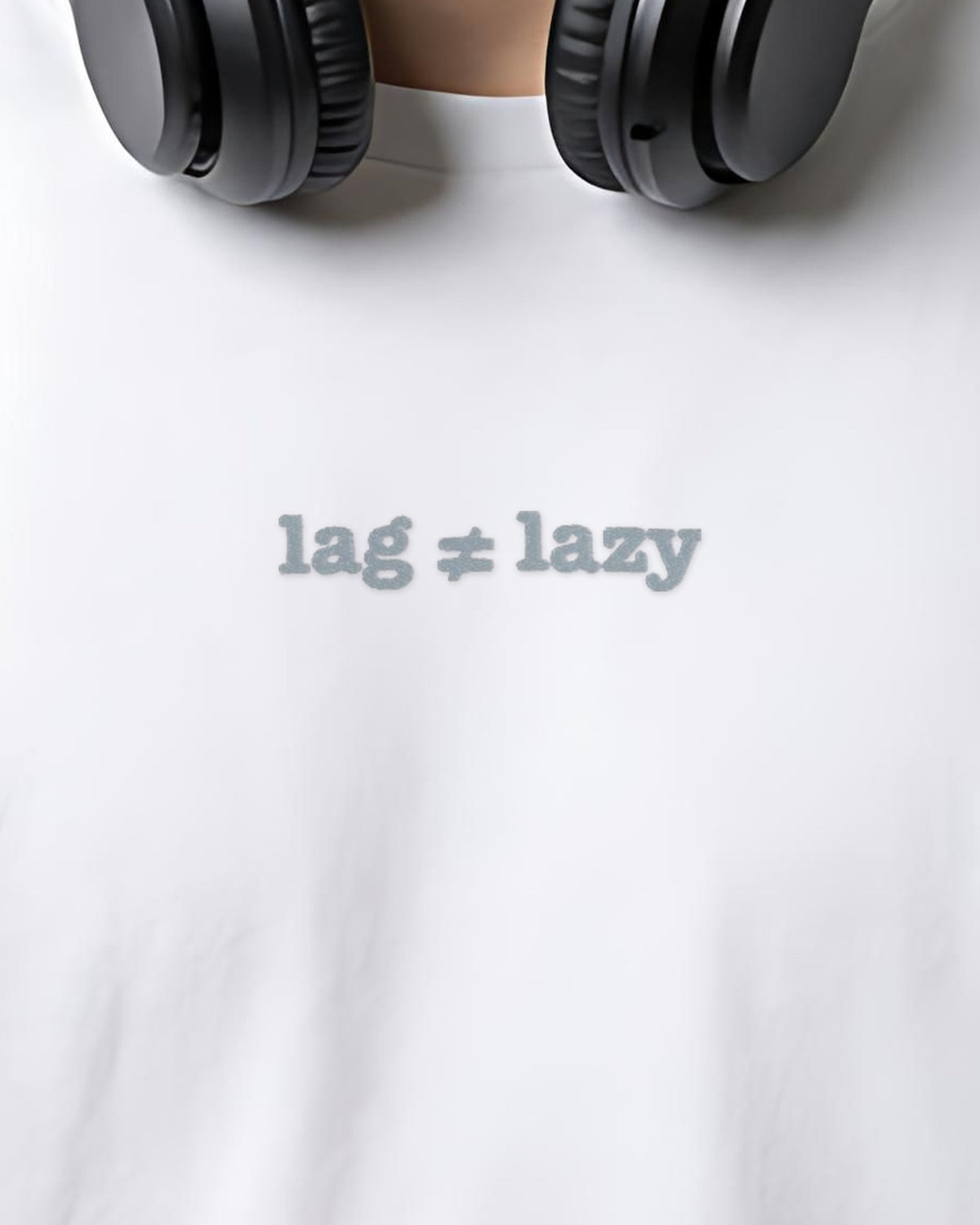 Lag isn't Lazy embroidered organic tee in White, worn, close-up of the chest embroidery