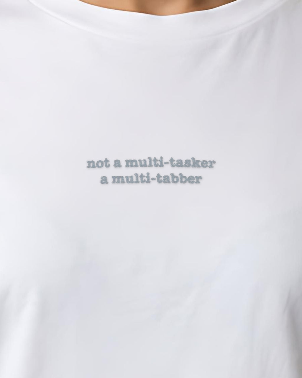 Not Multi-tasker ... Multi-tabber embroidered organic tee in White, worn, close-up of the chest embroidery