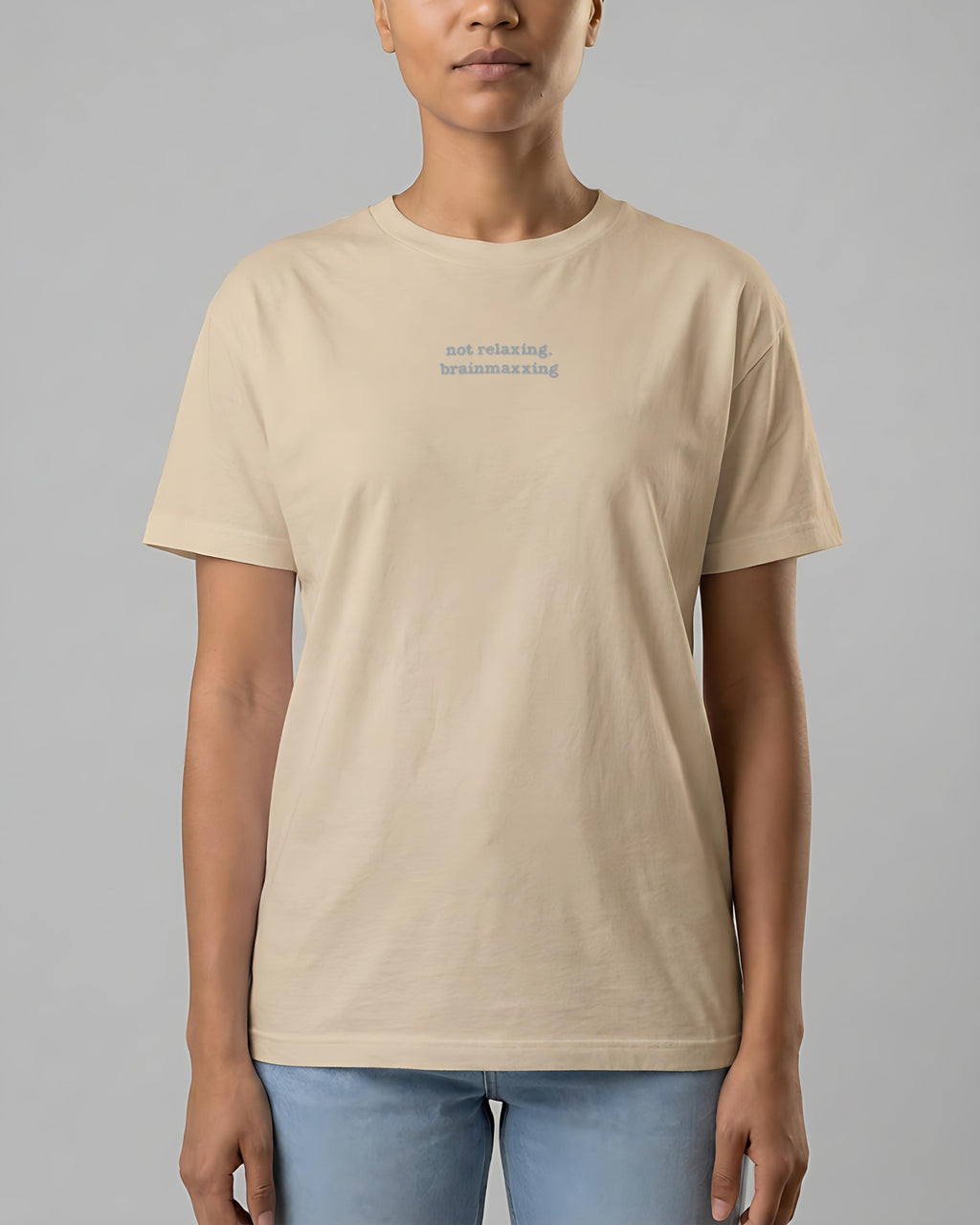Not Relaxing. BrainMaxxing embroidered organic tee in Desert Dust, worn, front view