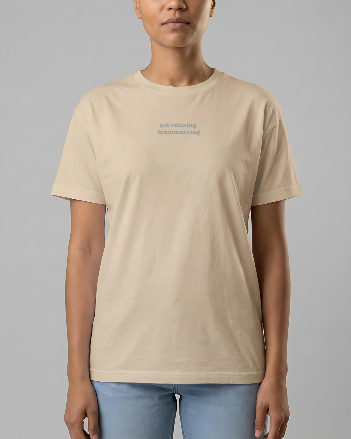 Not Relaxing. BrainMaxxing embroidered organic tee in Desert Dust, worn, front view