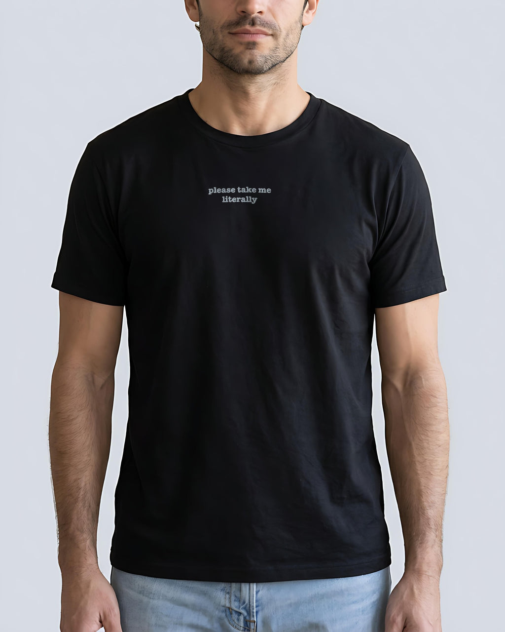 Please Take Me Literally embroidered organic tee in Black, worn, front view