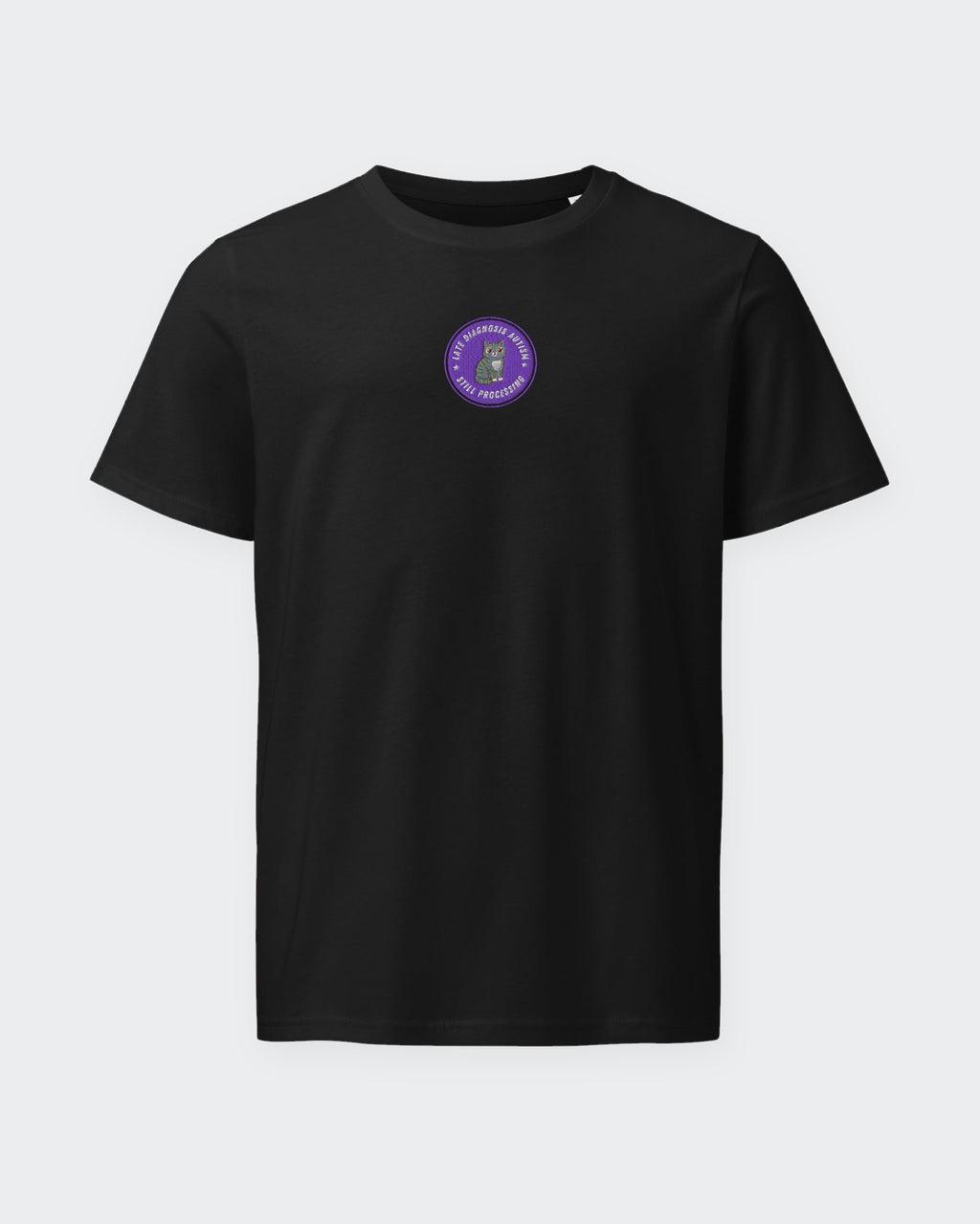 Still Processing organic embroidered badge tee in Black, laid flat
