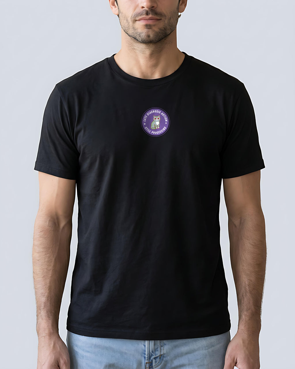 Still Processing organic embroidered badge tee in Black, worn, full front view