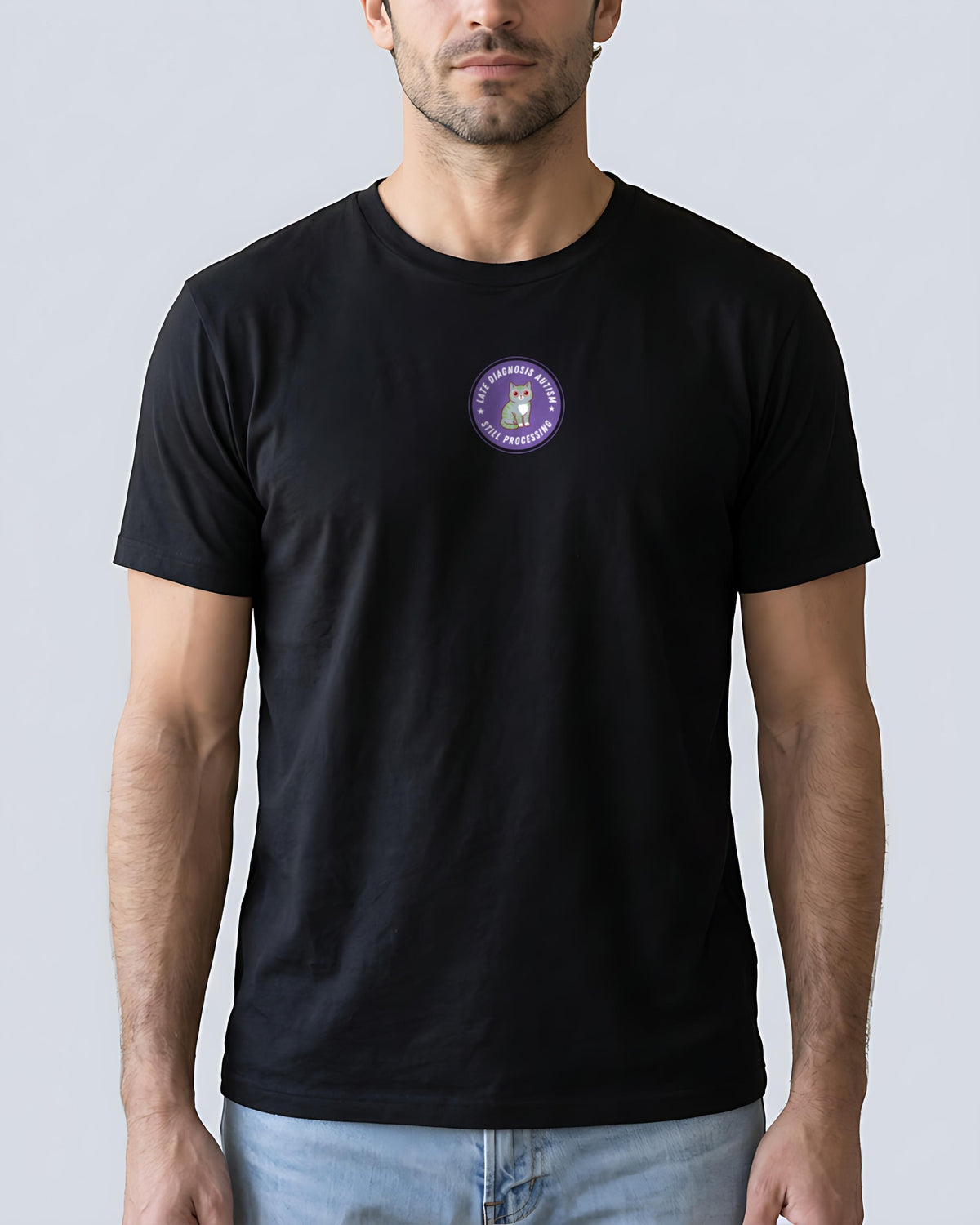 Still Processing organic embroidered badge tee in Black, worn, full front view