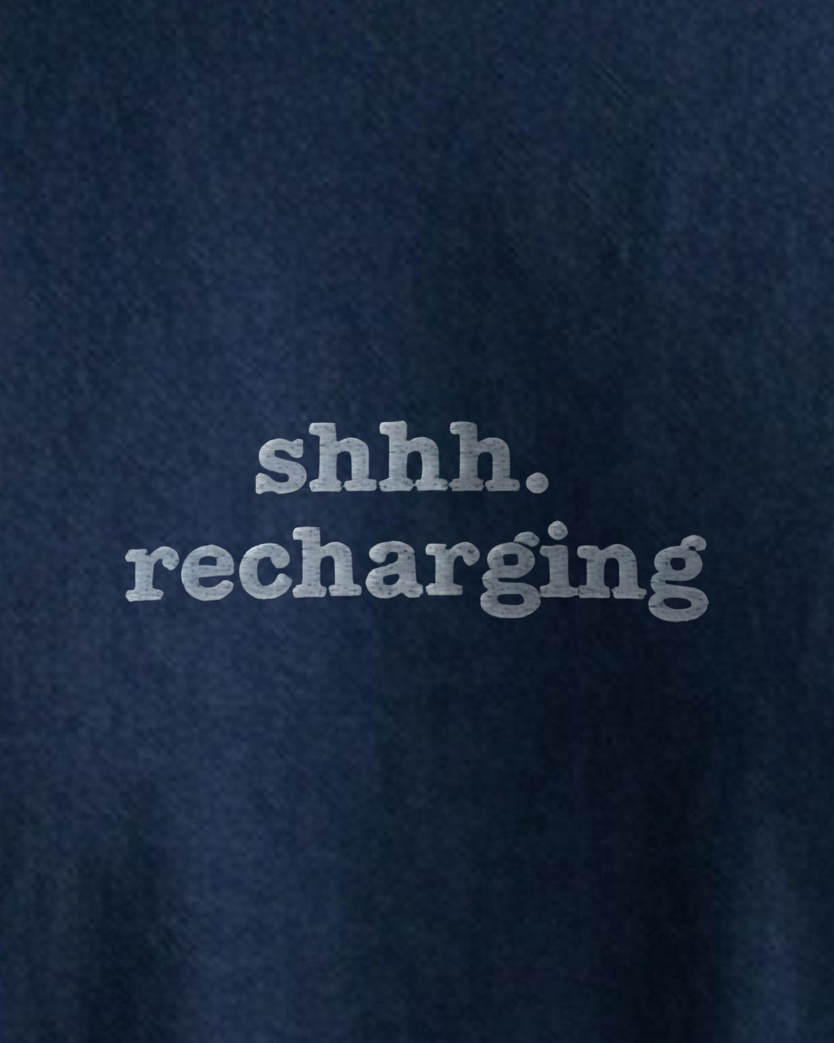 Shhh. Recharging embroidered organic tee in French Navy, close-up of the embroidered slogan