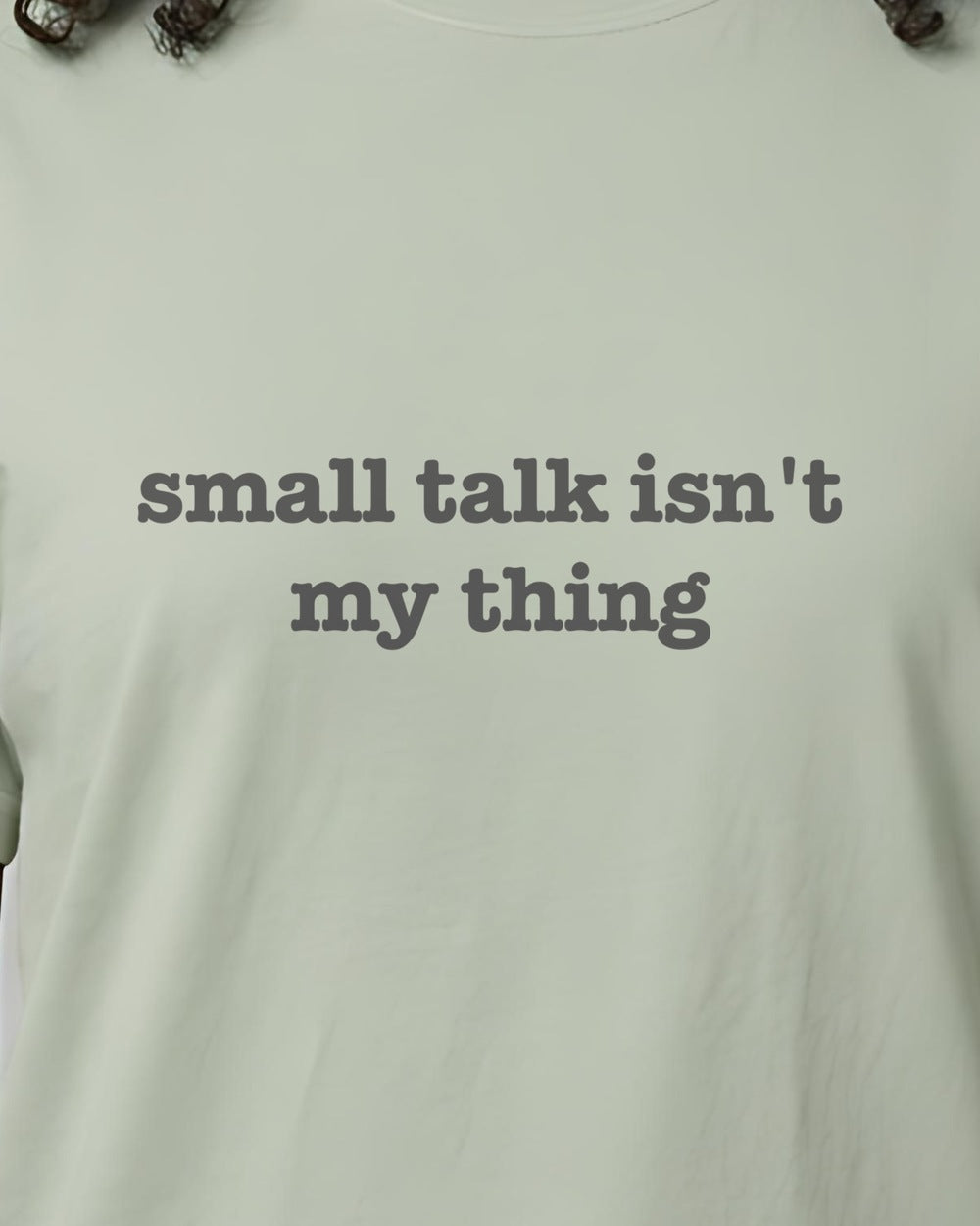 Close-up of the "small talk isn't my thing" slogan