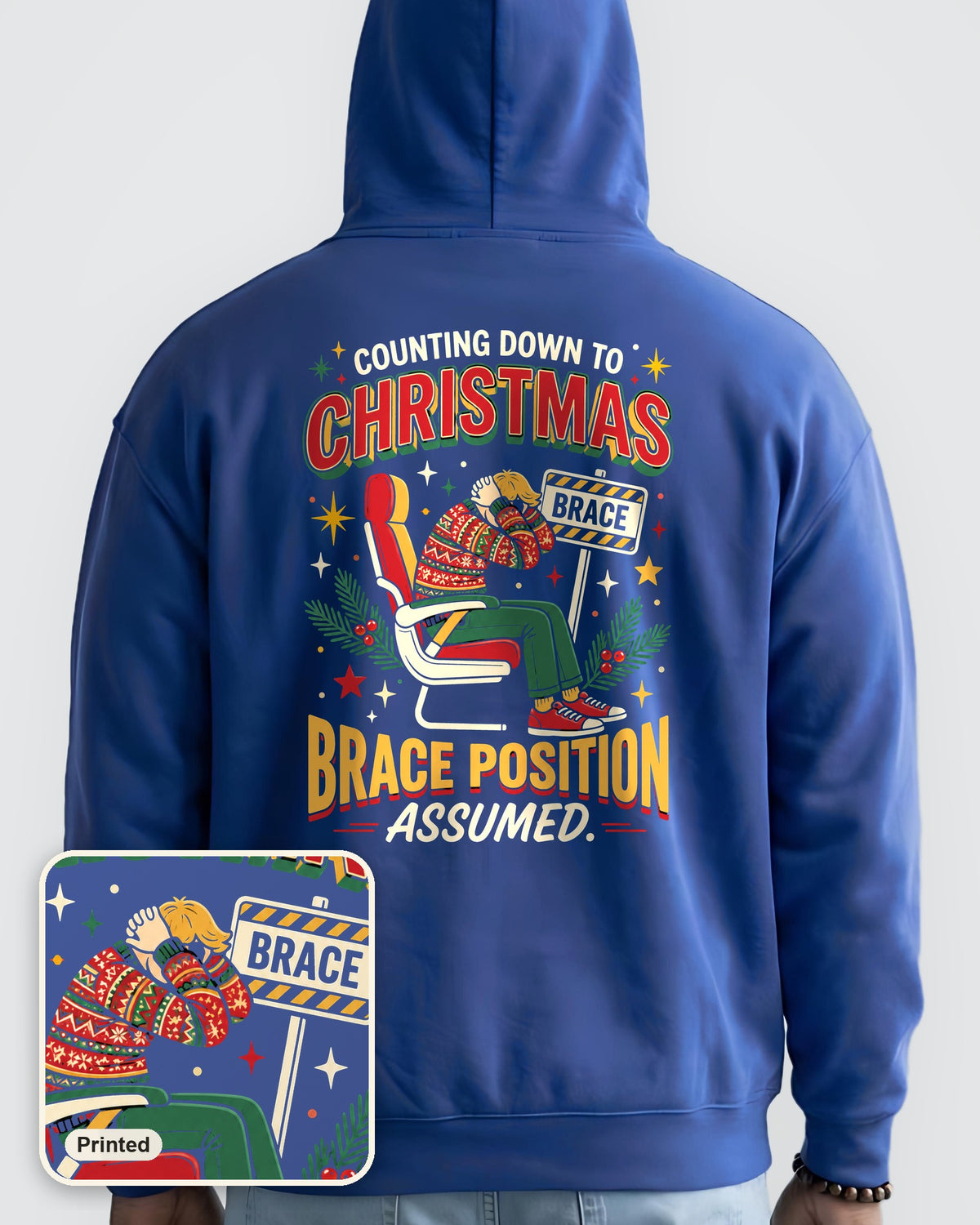 Brace for Christmas! oversized hoodie in Cobalt, worn, back view, large back print, with a close-up showing the design is printed