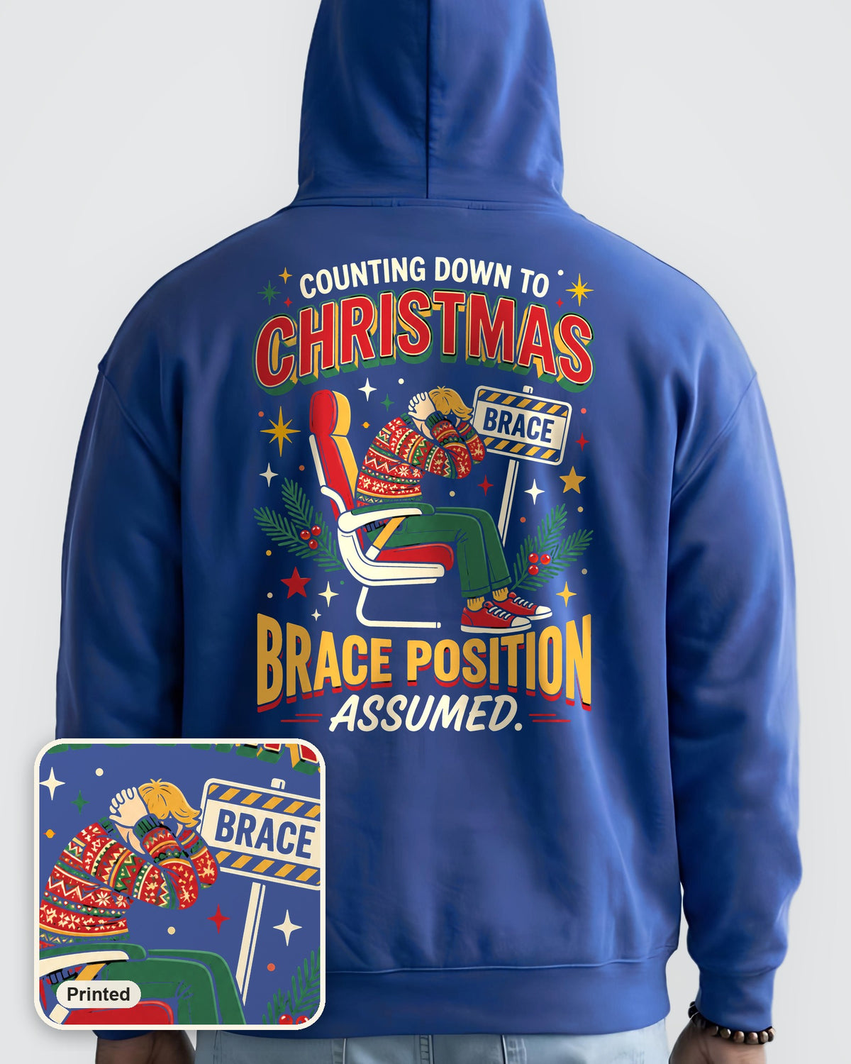 Brace for Christmas! oversized hoodie in Cobalt, worn, back view, full-size back print, with a close-up showing the design is printed