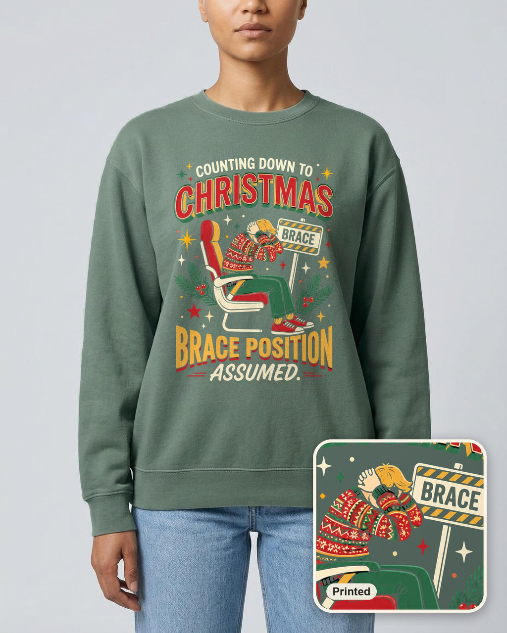 Christmas Countdown: Brace Position sweatshirt in Blue Spruce, worn, with a close-up showing the design is printed