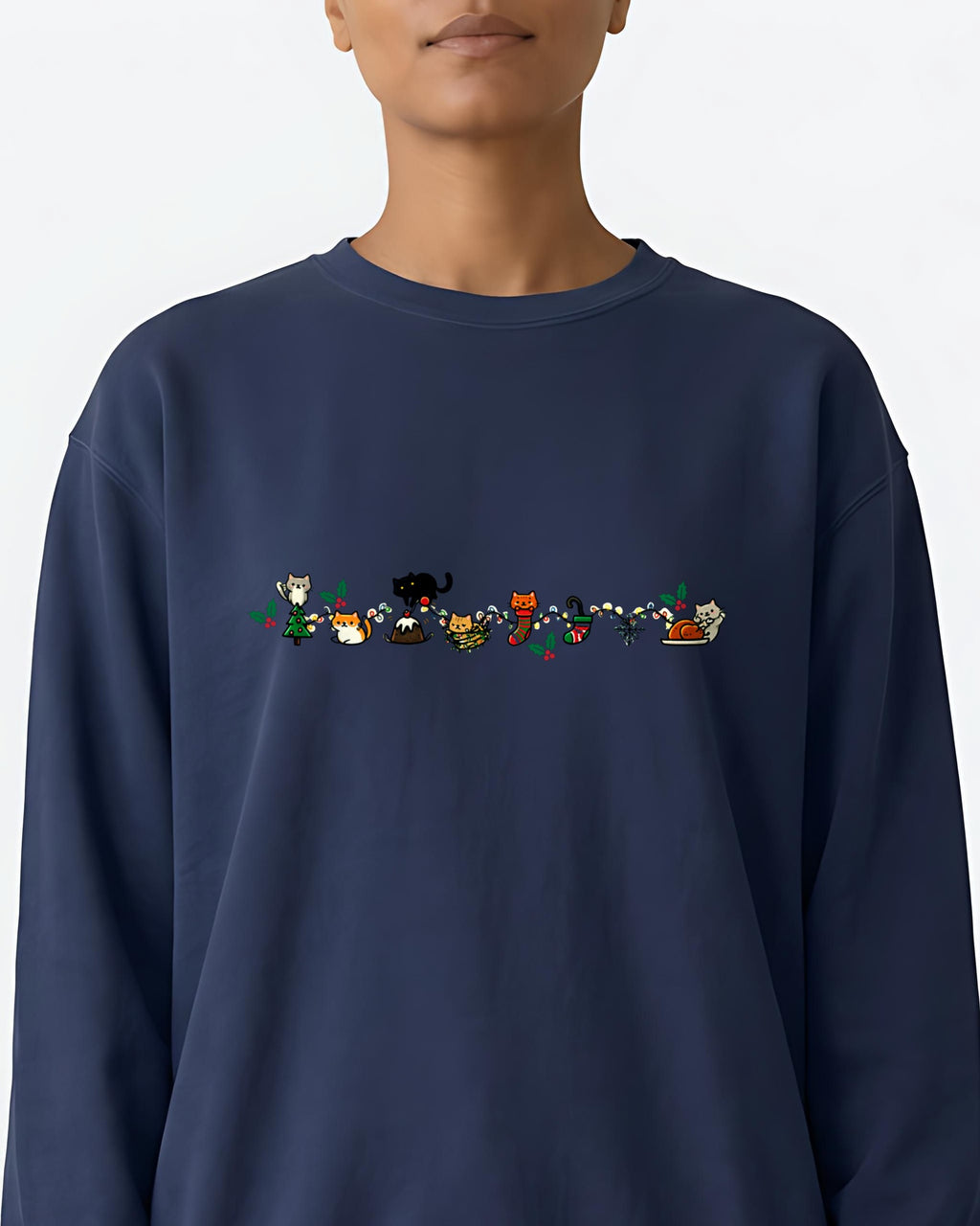 Cozy Catty Christmas garment-dyed sweatshirt in True Navy, worn, close-up of the front print