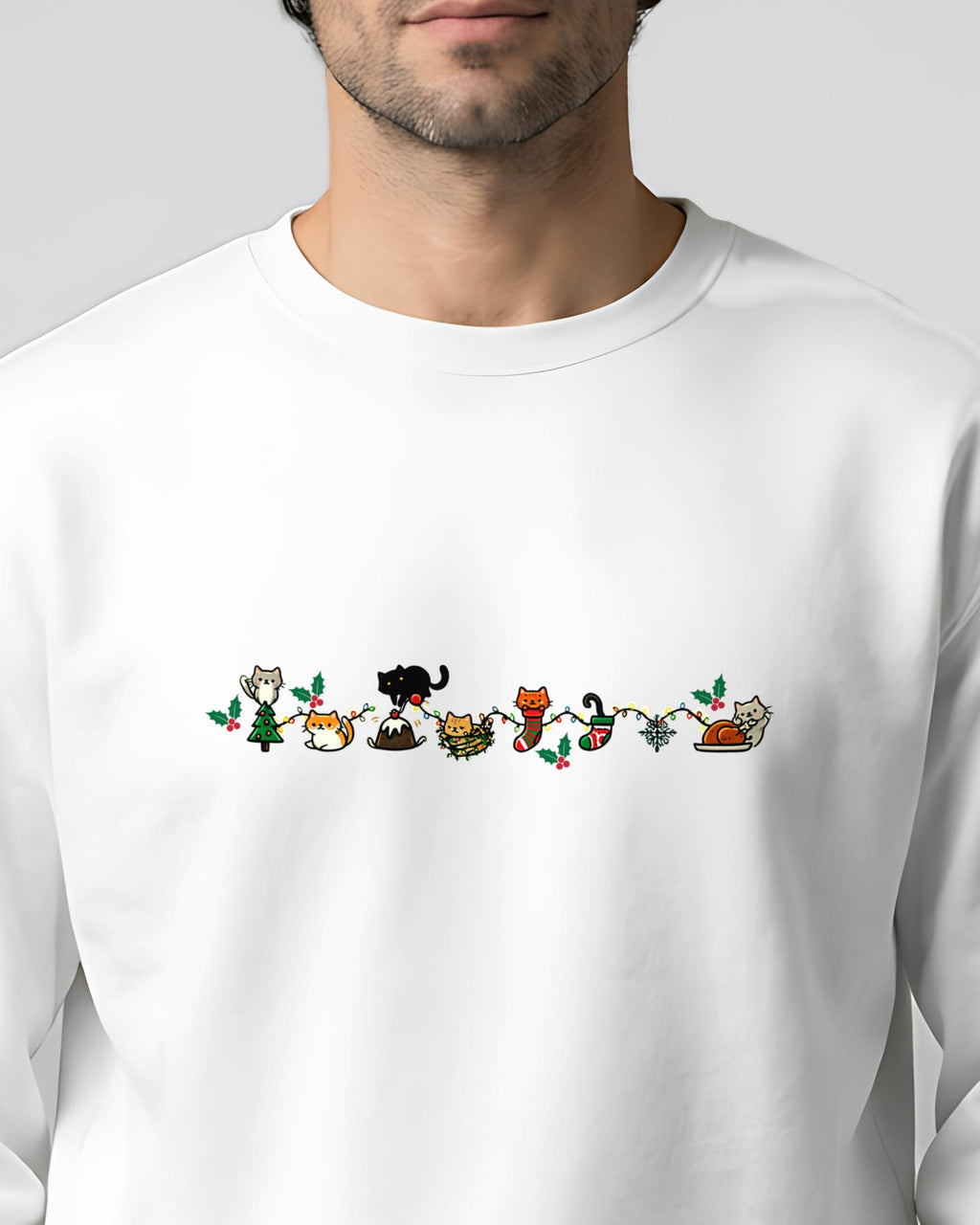 Cozy Catty Christmas garment-dyed sweatshirt in White, worn, close-up of the row of Christmas cats